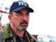 Tom selleck as jesse stone in a ballcap looking intense